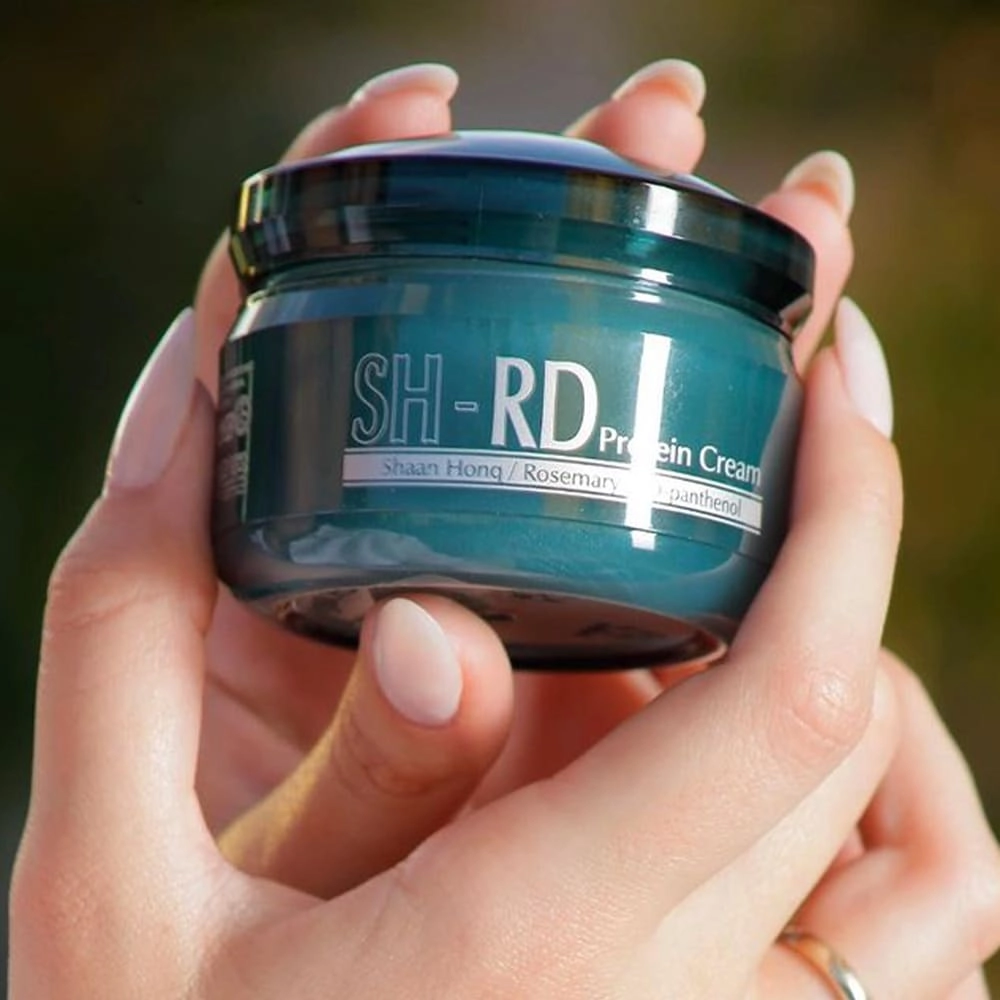 Produto: Kit SH-RD Nutra-Therapy Protein Leave-in Restaurador 150ml e Bolsa Comemorativa (2 produtos)